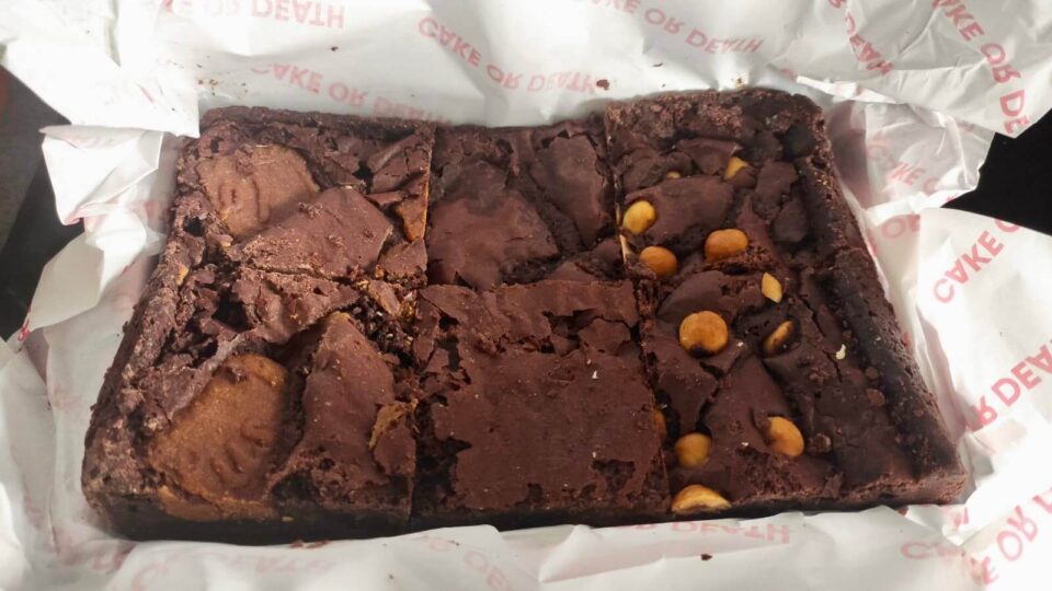 Delicious Cake or Death brownies, a box of six, nestled in white tissue paper. These are the referral gifts I send to my clients. 